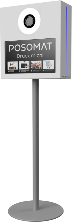The POSOMAT S1000 cut out: white photo booth housing with camera and screen on a stainless steel stand